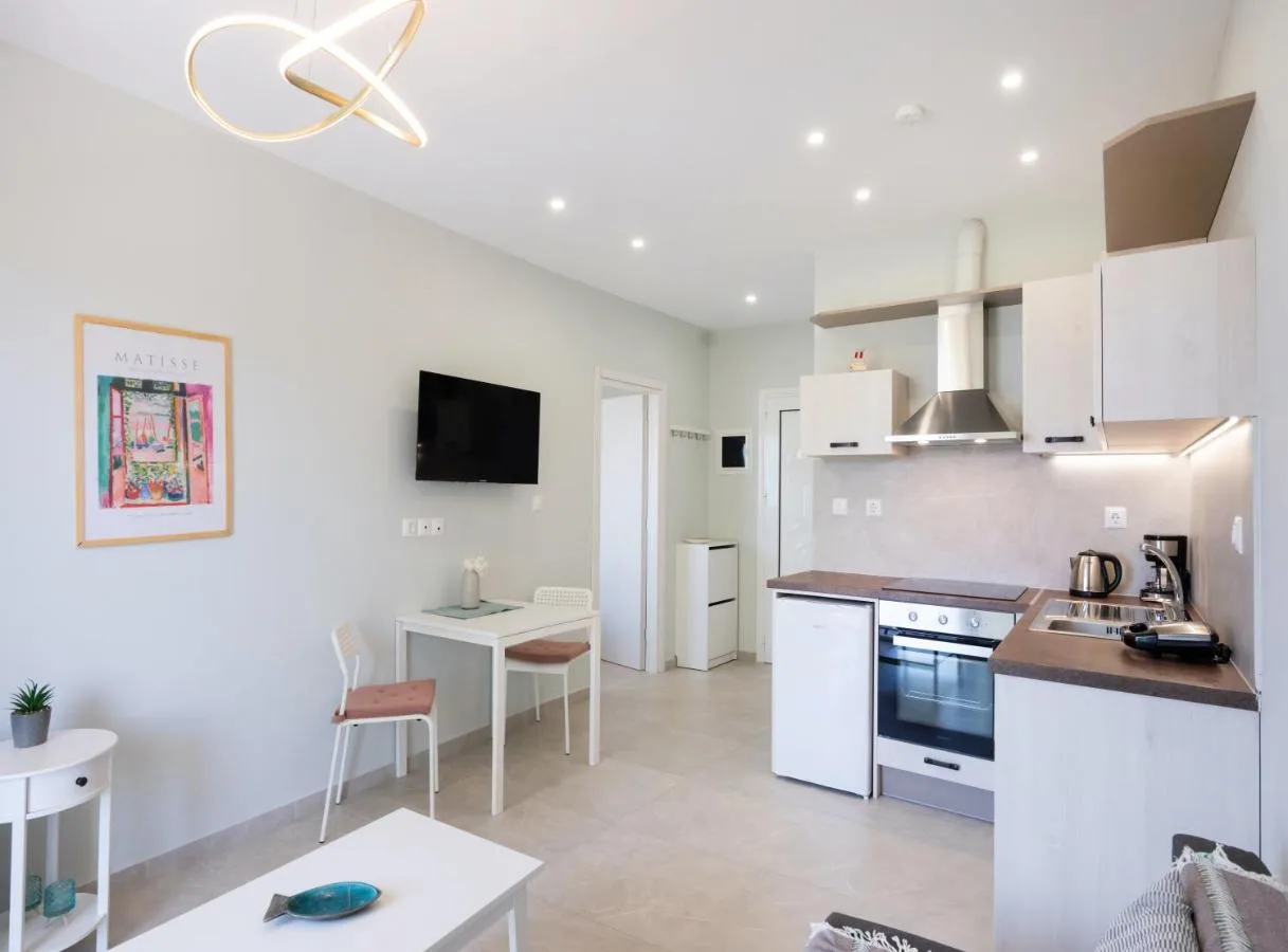 Living room with kitchen and balcony door access