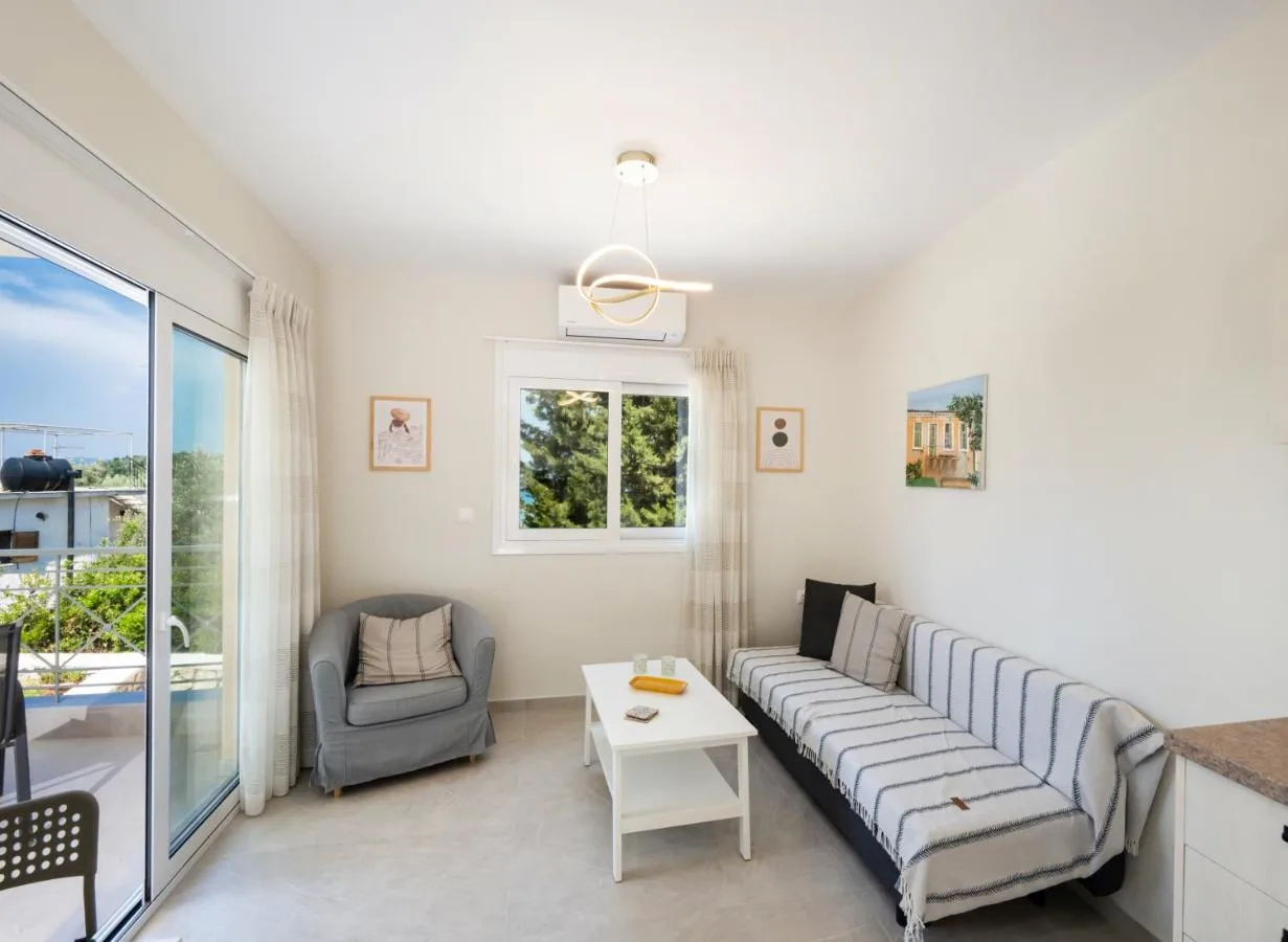 Open-plan room with sliding door to balcony