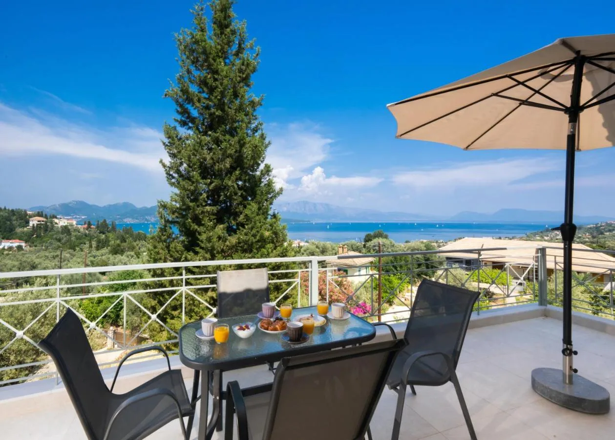 Terrace table with umbrella and panoramic backdrop
