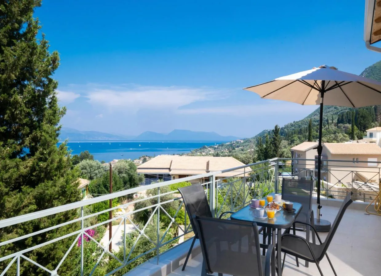 Terrace perspective with umbrella and coastal outlook