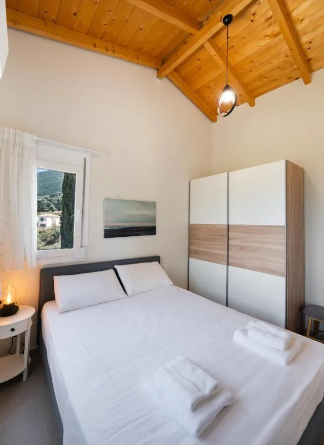 Bedroom with wardrobe and side window by the bed