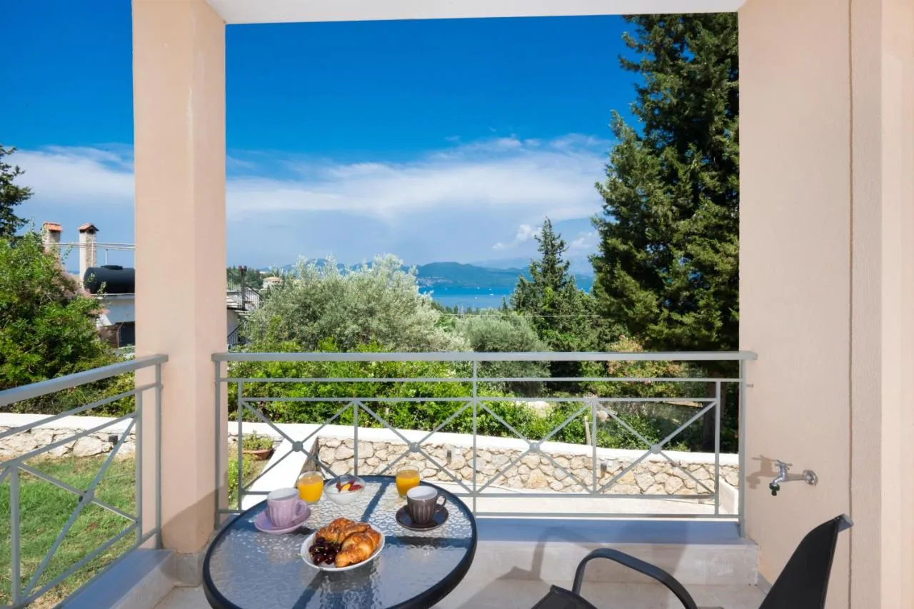 Corner terrace setup with breakfast and Ionian view