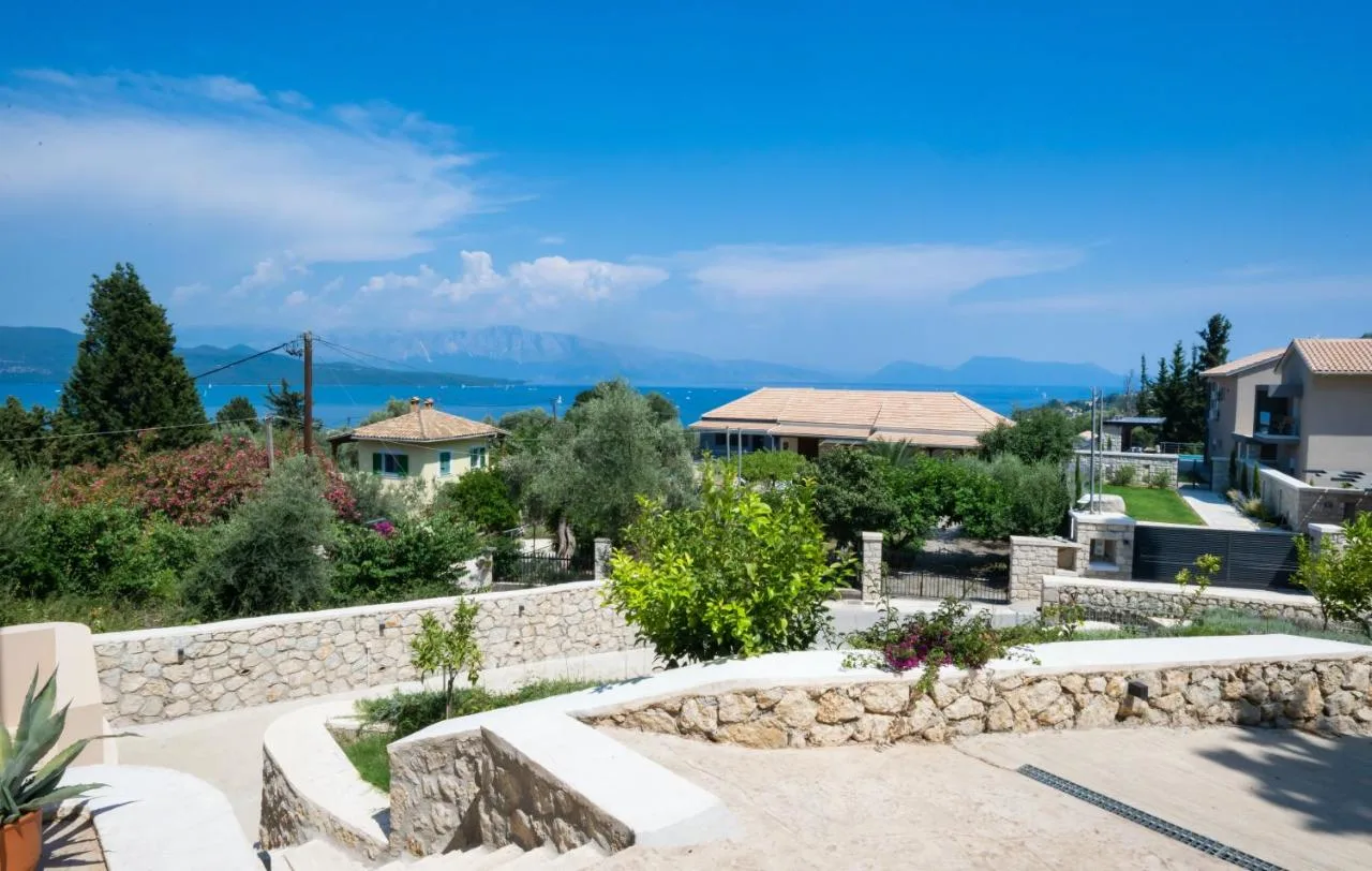 Outdoor courtyard view with sea in the background